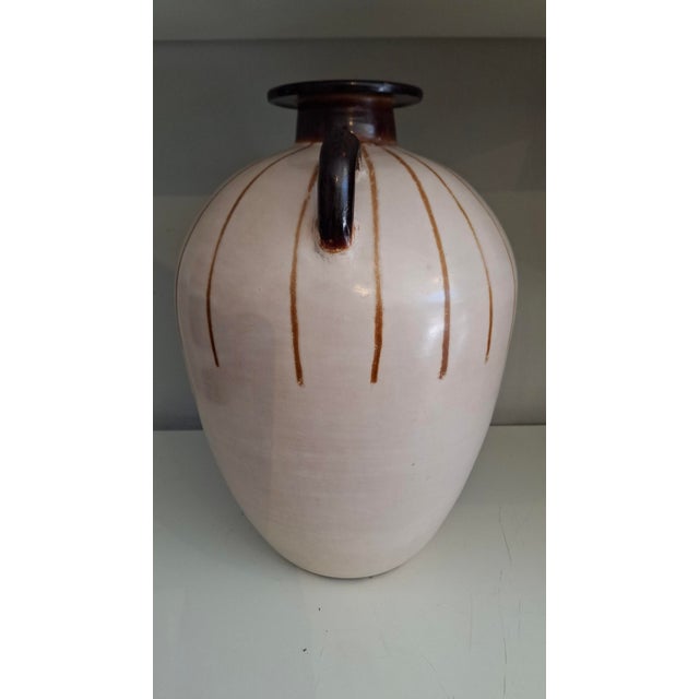 Chulucanas-style pottery is made in far north of Peru in a technique that dates back to pre-Incan times. Basic materials,...