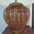 Charming woven rattan table lamp featuring an open basket-style base in a rich warm brown finish. The sculptural woven...