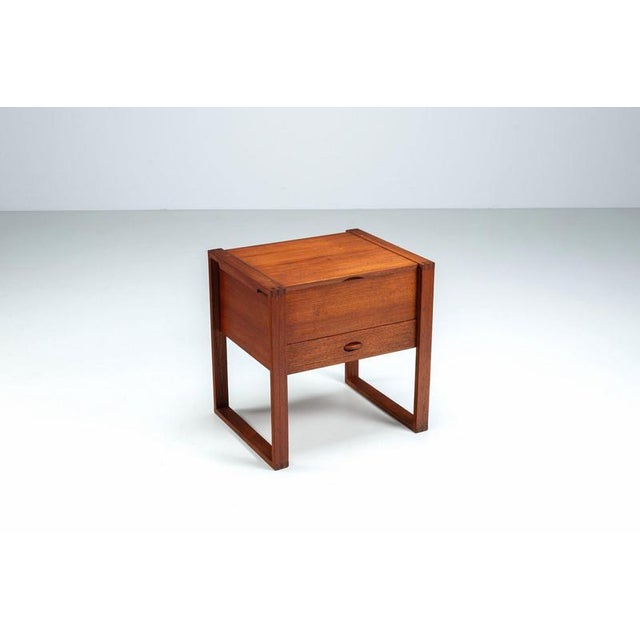 Scandinavian modern storage cabinet in teak, Denmark, 1960s. A beautifully crafted and highly functional piece featuring...