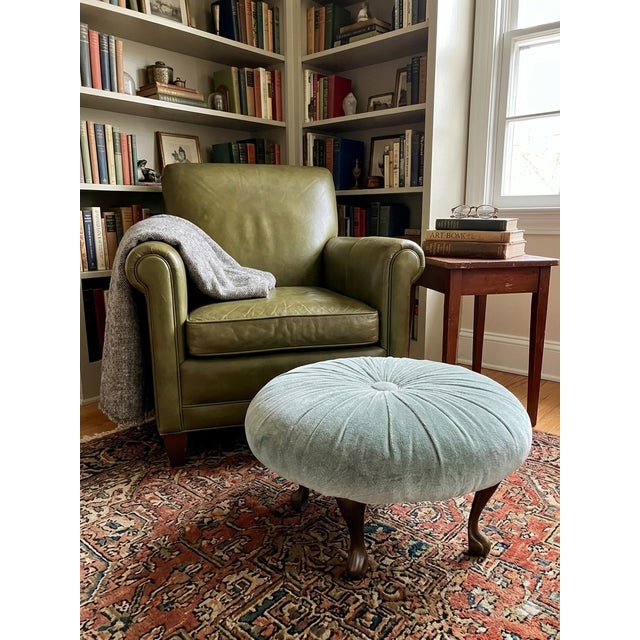 Elevate your space with this captivating vintage Hollywood Regency round footstool ottoman, beautifully upholstered in a...