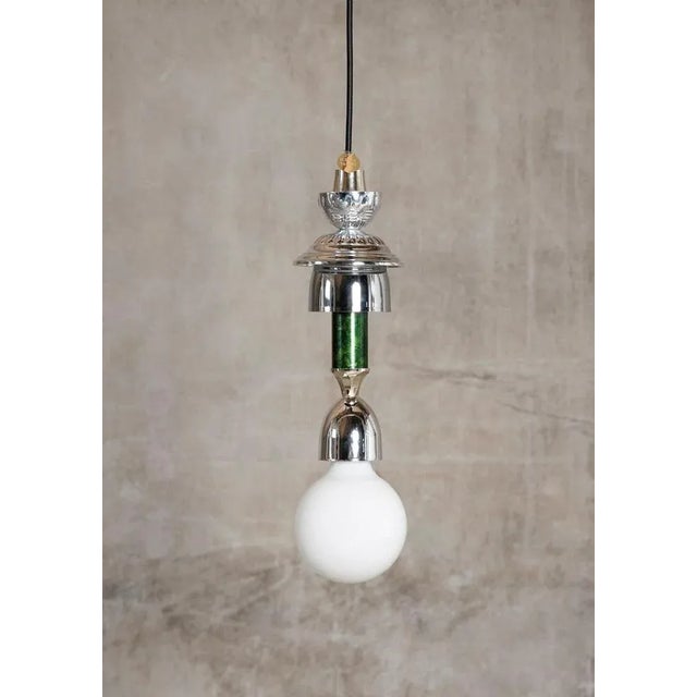 Silver, Green L3 Light by Flétta Dimensions: 34 x 4 cm Materials: silver Trophy is a collection of tables, lights,...