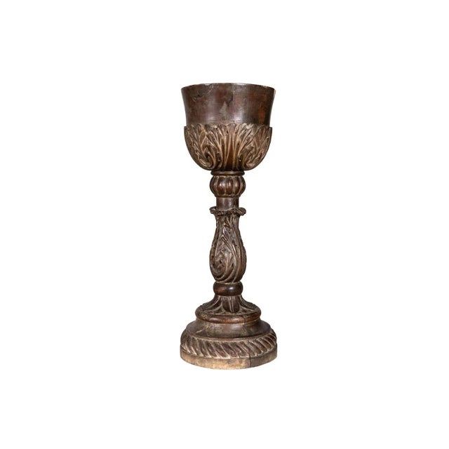 Hand carved ornate wooden cup with acanthus details.