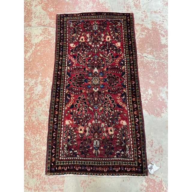 Antique Persian Sarouk rug, hand-knotted in Iran from 100% wool. Measuring 2’ x 3’11”, the rug features a richly detailed...