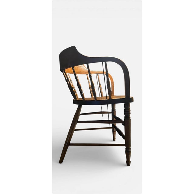 Gorgeous, Solid Oak Captain's Chair or also known as a Firehouse Chair, featuring a metal support rod from the armrest...