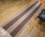A vibrant and artful vintage American Amish rag runner, handwoven in the early 1900s by Amish and Mennonite communities in...