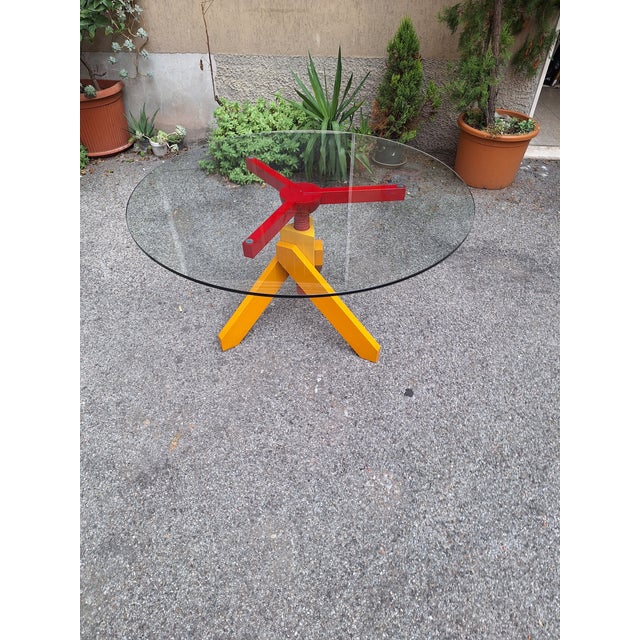 Vico Magistretti Vidun Dining Table with Round Glass Top and Red and Yellow Beech Legs by Vico Magistretti for De Padova, 1980s For Sale - Image 4 of 12
