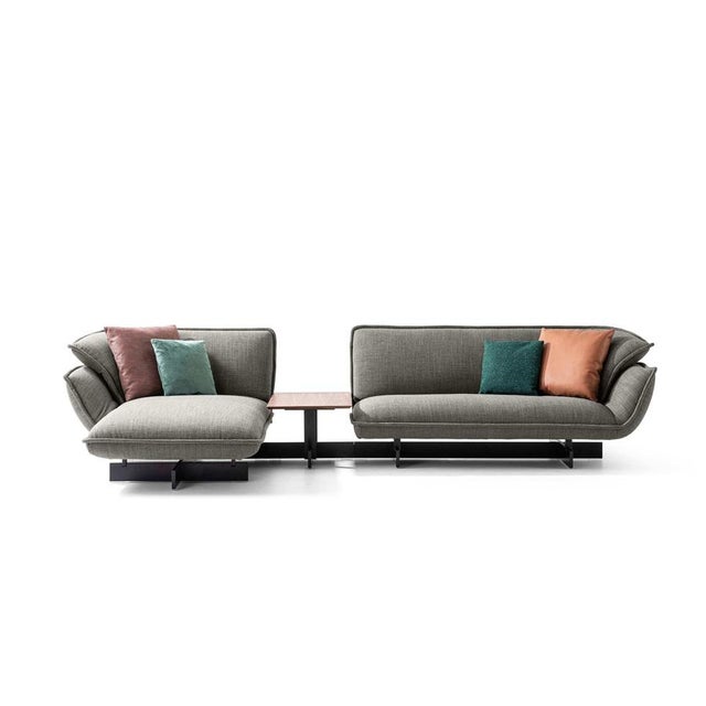 Patricia urquiola beam sofa system for cassina an innovative upholstered seating system, supported by a beam that allows...