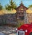 A painting of a vintage red truck parked in front of a "shrine" which caught my attention. Early morning light was...