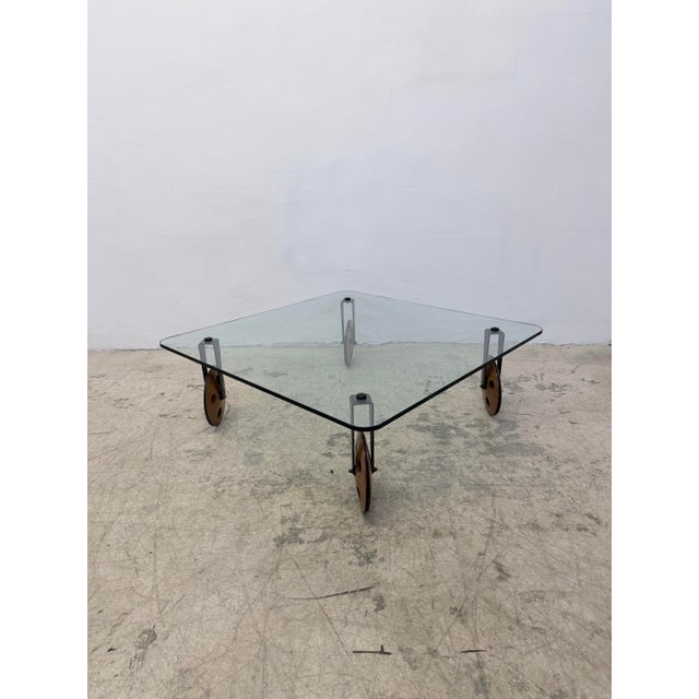 Post-modern coffee table in the style of Gae Aulenti for Fontana Arte, designed after Aulenti's "Tavolo con Ruote"....