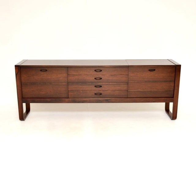 A superb vintage sideboard by Gunther Hoffstead for Uniflex. This was made in England, it dates from the 1960’s. The...