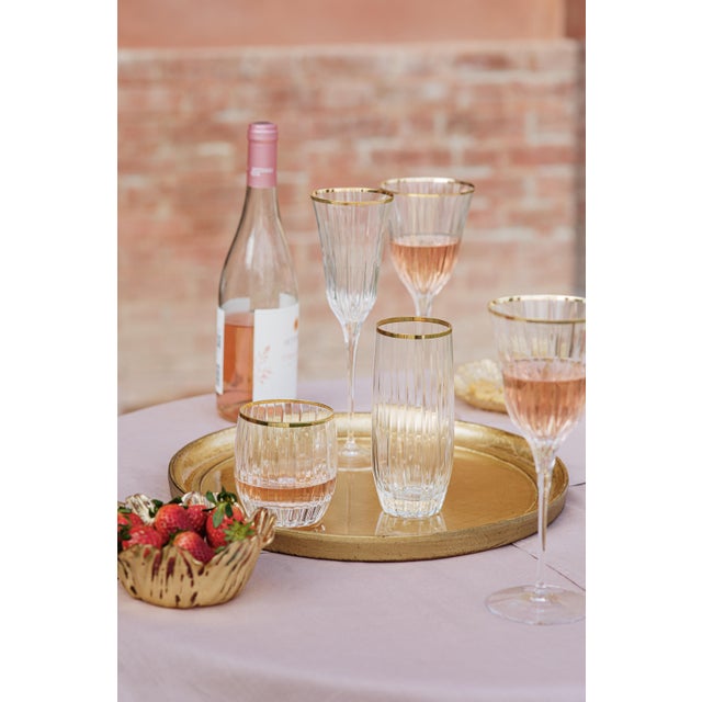 Classic and celebratory, Natalia Gold Champagne Glass features a resplendent golden rim atop a glass reminiscent of cut...