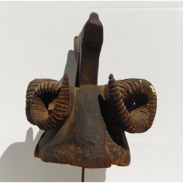 Very rare African art piece Cameroon head mask. The piece is made of wood and was made ca.1880. Traces of red paint 12 1/4...