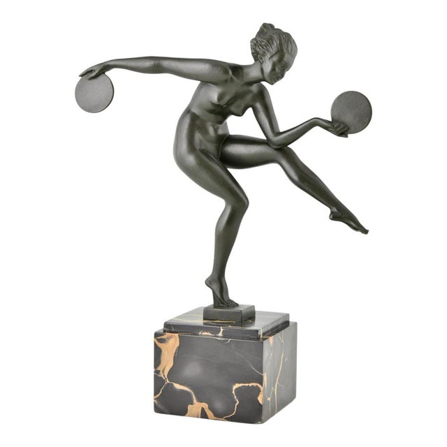This elegant Art Deco sculpture "Danse Païenne" is a remarkable example of French decorative sculpture from the 1930s. The...