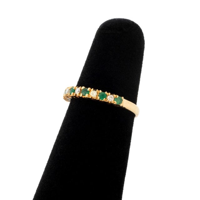14K Yellow Gold Emerald and Diamond Ring, featuring six prong set round brilliant cut emeralds weighing a total of approx....