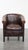 Offered this comfortable and elegant club chair in a beautiful dark color made of English style cowhide leather. This...