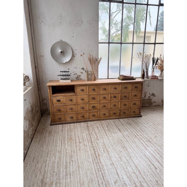 Antique xl pine workshop cabinet from the 1950s. we love this large workshop cabinet with its numerous drawers and niche...