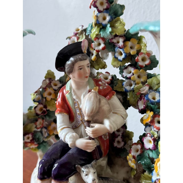 A rare and visually captivating pair of 18th-century German porcelain figural candelabras produced by the prestigious...