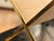 This stylish magazine rack is crafted from woven cane and brass and was inspired by bamboo and raffia designs from the...