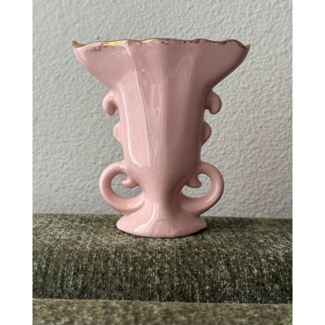 petite mid-20th-century porcelain vase by St. Regis American Porcelain. The vase features a soft pink glazed finish,...