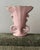 petite mid-20th-century porcelain vase by St. Regis American Porcelain. The vase features a soft pink glazed finish,...