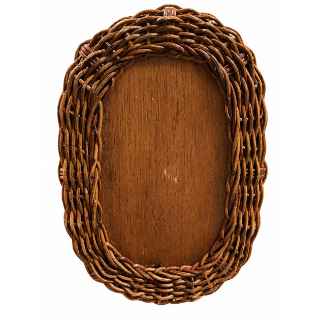 Description: Charming vintage woven wicker basket, circa 1970s, featuring a beautifully detailed open-weave construction,...