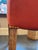 This is an antique wingback chair. It has a fabulous woven wool red shade fabric. There are brass nail head detailing for...