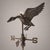 a rare copper weathervane from the early 1900s, featuring a three-dimensional composition depicting a duck with open...
