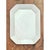 This vintage serving platter is a clean, architectural piece of white ceramic, cut in an elongated octagon with softly...