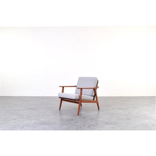 This teak armchair was made in Denmark in the 1960s. The frame of the easy chair is made of solid teak wood and has been...