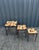 A set of three nesting coffee tables in different sizes, covered in ceramic tiles by the renowned ceramicist Mado Jolain....