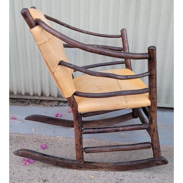 1930's Old Hickory rocking chair with hand sewn leather seat and backing.This rocker is in fine condition.The chairs are...