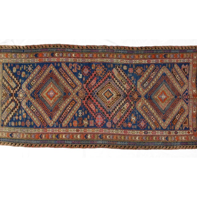 This masterpiece is a wool pile genuine handwoven antique Russian Soumak kilim. The piece is in excellent condition.