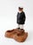 Vintage nautical pipe holder featuring a sculpted sea captain figure and faux burl wood style base. Warm brown tones,...