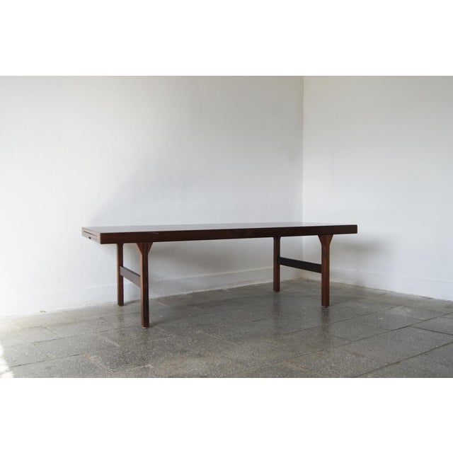 A celebration of the sophisticated and beautifully refined design of the rosewood folding table carved by Dyrlund in the...