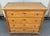 This massive pine chest of four more or less equal depth hand-cut dovetailed drawers is about as handsome as they come....