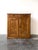 An antique late 19th century French elm cupboard with beautiful wood grain and a warm patina. Two drawers with wooden...