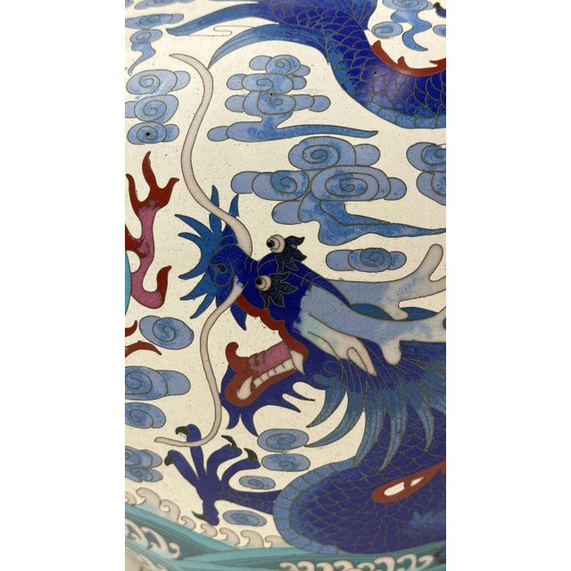 A striking and monumental pair of Chinese cloisonné enamel vases, each standing approximately 26 inches in height,...