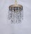 Italian layered chandelier with brass rim and 30% leaded Swedish cut crystal drops. It has 1 Edison base socket that holds...