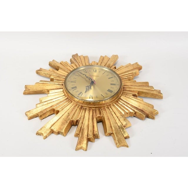 Sunburst wall clock by the brand Electrica. High-quality quartz movement by Kienzle. The clock runs absolutely reliably...