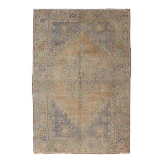 Vintage Turkish Oushak Rug With Muted Colors and Central Medallion Design For Sale