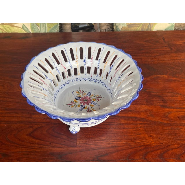 Here is a beautiful Majolica Alcobaca bowl that is hand painted with florals and vines. The edge and bottom rim and feet...