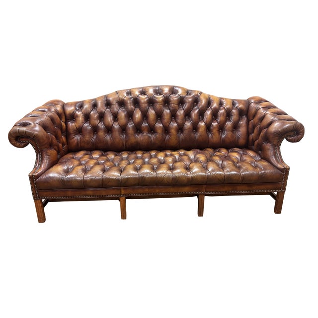 Luxury and high quality Queen Anne–style furniture, this brown-colored pin-cushion couch features the signature graceful...