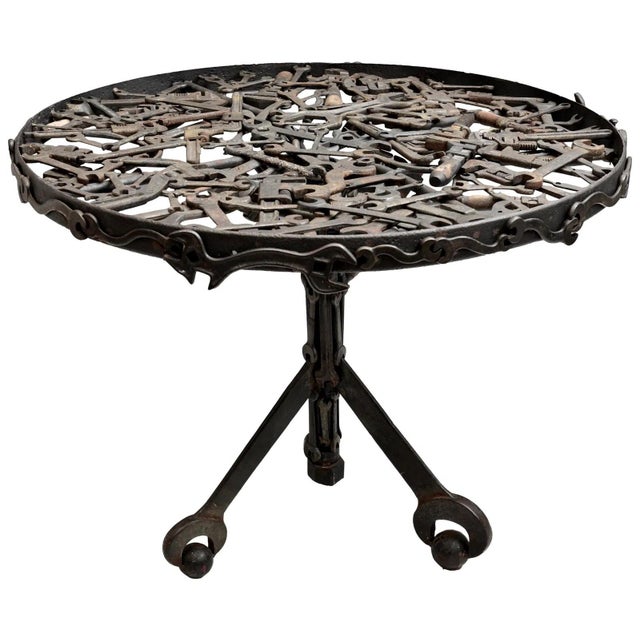 A handmade center hall-sized one-of-a-kind table well crafted from antique and vintage hand wrenches with a thick glass...