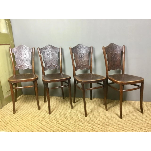 Authentic set of 4 chairs, manufactured around 1900 in Vienna and stamped and labeled by Jacob & Josef Kohn. The chairs...