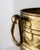 This large vintage brass planter or wine cooler from the 1970s is a striking decorative vessel with dual side handles and...