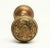 Flemish style two fold passage door knobs made by Corbin in the 1905 catalog. They are made of lightweight brass with a...