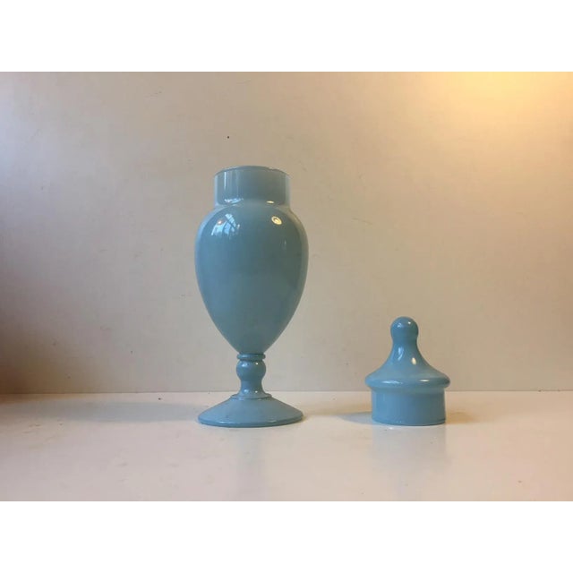 This light blue urn or lidded vase was designed by Cenedese Vetri of Murano, Italy. It was designed and manufactured...