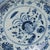 An elevated example of Chinese blue-and-white ceramics, this large, footed dish is brushed with deep cobalt underglaze...