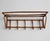 A beautifully crafted wall-mounted coat and hat rack produced in czechoslovakia during the 1960s and attributed to úluv...