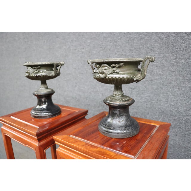 Victorian Bronze & Wood Urns/Pair Bronze Victorian design, black wood bases. *Late 19th Century